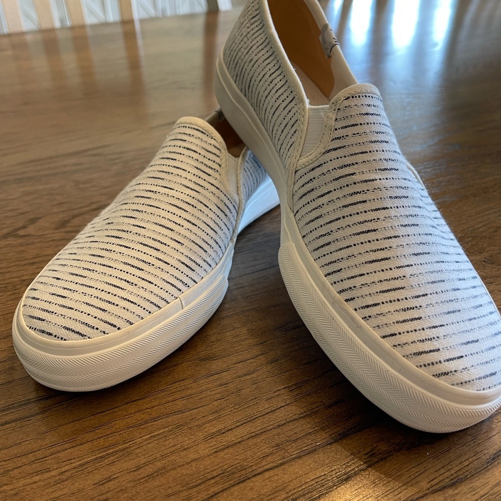 Keds White and Black Slip-On Sneakers with Textured Design